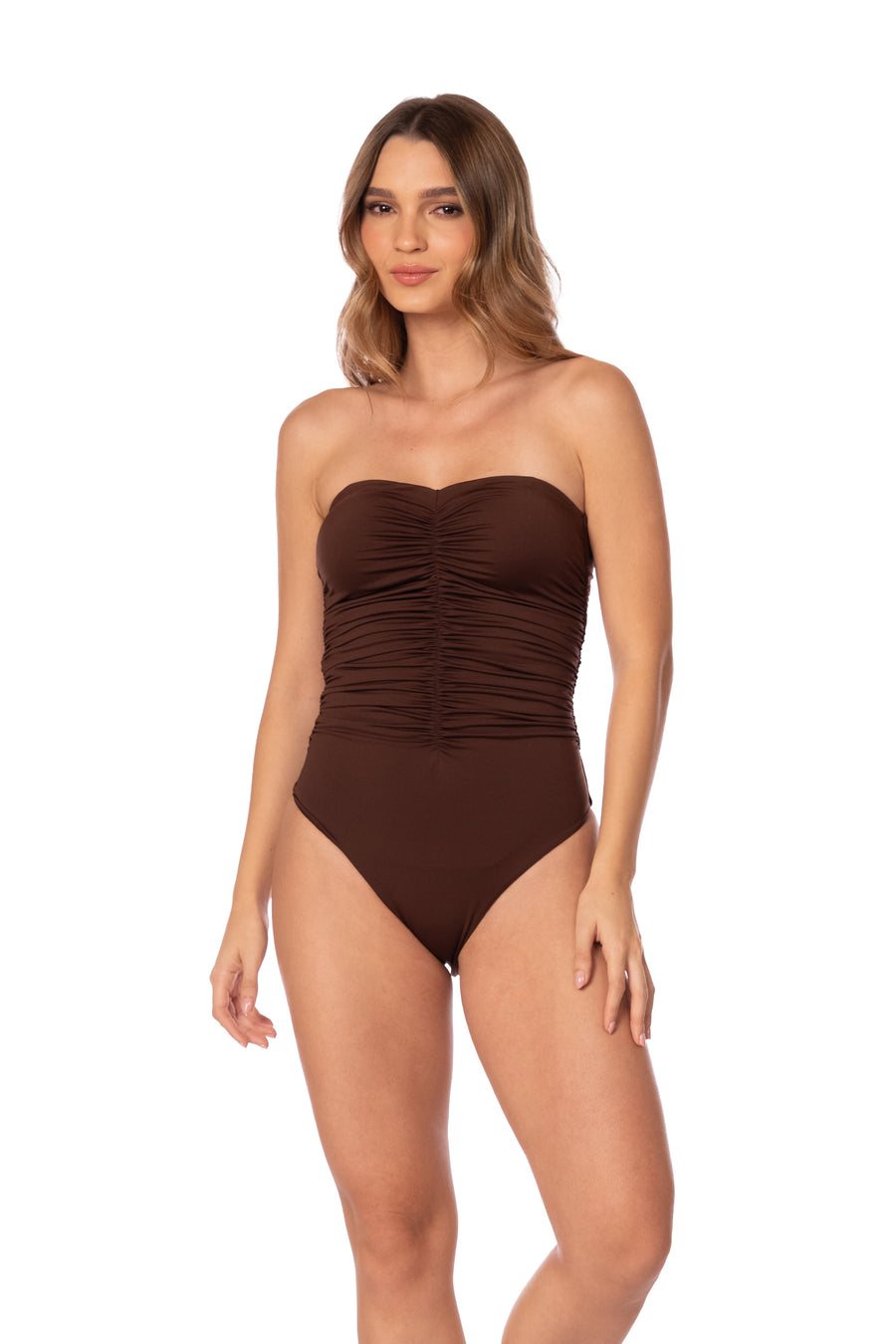 Woman wearing a brown strapless swimsuit on a white background